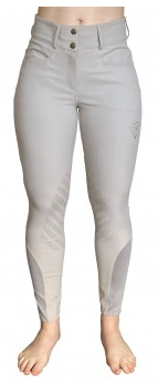 Woman wearing light grey Paragon Performance Rebecca knee patch breeches for riding.