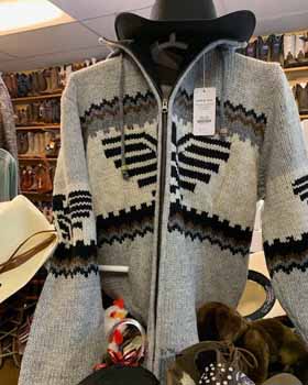 Warm wool sweater with black, white, and beige geometric design.