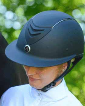 Horse riding helmet with secure fit and ventilation for rider safety.